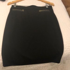 Black pencil skirt with gold zipper detail